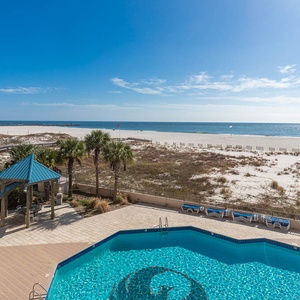 Take in the stunning views from the pool area, surrounded by palm trees and just steps from the beach