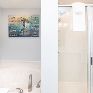 Indulge in relaxation in the master bath with a refreshing walk-in shower and soothing jetted tub