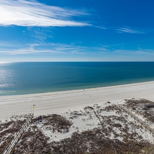 Take in the serene views from your balcony, overlooking the tranquil waters and the inviting shoreline below