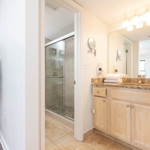 Stylish master bathroom featuring a spacious vanity and a refreshing walk-in shower
