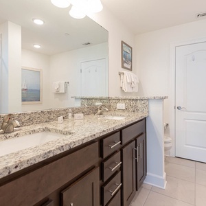 Refresh in the master bath with a walk-in shower, dual vanity, and soothing tub