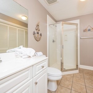 Refresh in this additional guest bath with a walk-in shower and laundry area with a washer and dryer in your rental