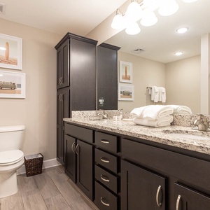 Indulge in relaxation in the master bath with a refreshing walk-in shower and soothing jetted tub