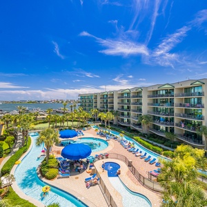 Delight in vibrant poolside views from your spacious balcony, perfect for savoring the refreshing coastal air