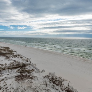 Breathe in the fresh air from your balcony, overlooking the beach and gentle waves stretching into the horizon