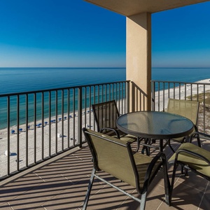 Enjoy meals or drinks at the outdoor table while taking in the tranquil beach views from your balcony