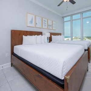 Bask in gulf view beside two comfy queen beds and take in the beach from this guest suite