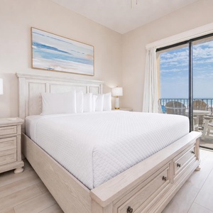 Rest your head in the king master suite while the distant tide hums beyond your balcony chairs