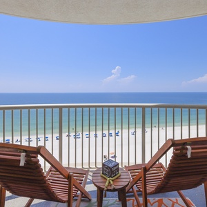 Relax on the balcony in comfortable chairs, enjoying breathtaking beachfront views and a serene atmosphere