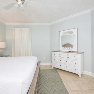 In the king master suite, unwind as you watch shows on the wall-mounted TV after a day on the gulf coast