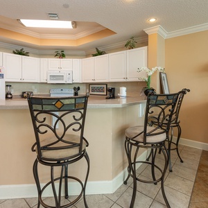 Wake up with morning coffee at the breakfast bar and get ready for a beach day in this stylish space