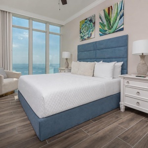 Relax on the cozy king bed in this guest suite and wake up to stunning beach views