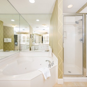 Indulge in relaxation in the master bath with a refreshing walk-in shower and soothing jetted tub