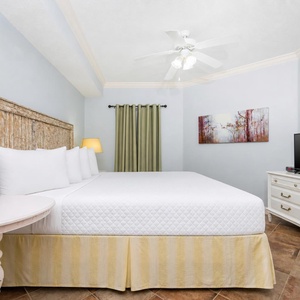 Drift off to sleep in the king master suite, where comfort awaits after a day of sun and fun along the coast