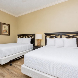 Relax on one of the cozy queen beds in this guest suite and enjoy a peaceful slumber