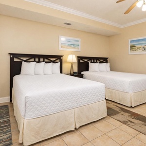 Rest easy in this cozy guest suite, where two double beds await for restful nights after beach adventures