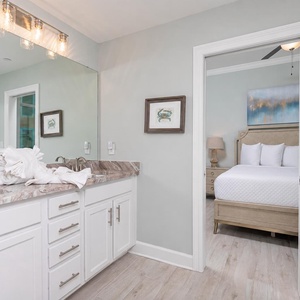 Freshen up in this guest bath in the relaxing shower or soothing tub before an exciting beach day