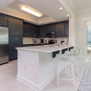 Cook and gather in this elegant kitchen with charming cabinetry, stainless appliances, and stylish countertops