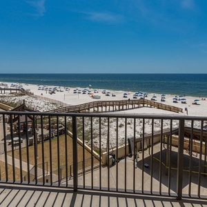 Enjoy breathtaking views of the beach and vibrant umbrellas from the extra-large extended balcony, perfect for relaxation