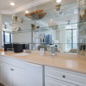 Grab a chilled drink from the fridge or create your favorite cocktail at the wet bar