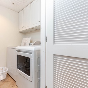 Enjoy the convenience of an in-unit laundry area with modern appliances and ample storage for your essentials