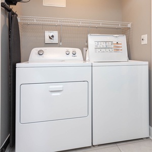 Effortlessly refresh your beachwear in the convenient laundry area, keeping your essentials ready for sunny days ahead