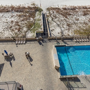 Inviting pool area, enjoying comfortable seating and easy access to the beach just steps away