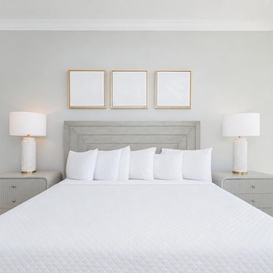 Cozy up in the plush king bed in the master suite with stylish lighting and elegant design