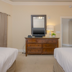 Unwind in this queen guest suite and watch some TV after a beach day