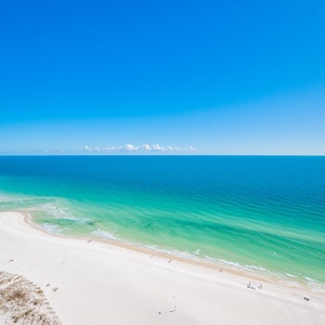Watch the coastline stretch into the distance and the horizon meet the sky from your balcony while you soak up the sun