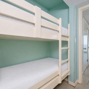 Bunk beds in the sleeping area offer a cozy spot for the kids after fun-filled days along the coast