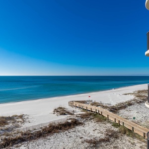 Breathe in the fresh air from the balcony while enjoying expansive views of the tranquil shoreline and inviting waters