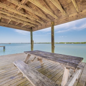 Relax on the dock with stunning views of the water and nearby amenities, perfect for a memorable Gulf Shores getaway