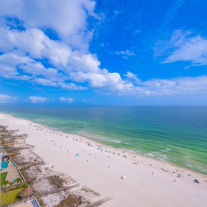 Watch the coastline stretch into the distance and the horizon meet the sky from your balcony while you soak up the sun