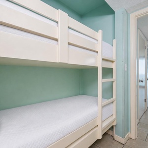 Bunk beds in the sleeping area offer a cozy spot for the kids after fun-filled days along the coast