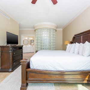 Unwind after a fun vacation day and stream your favorite shows in the king master suite with balcony access