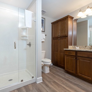 Refresh in this guest bathroom, where a sleek shower and elegant vanity enhance your serene getaway experience