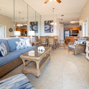 Relax on the cozy sofa with queen sleeper, surrounded by coastal decor, and enjoy the open layout