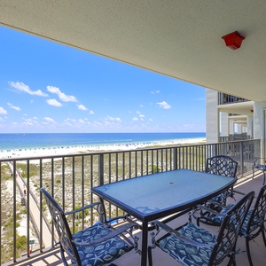 Balcony seating overlooks the beach, providing a serene spot to enjoy the gulf views and gentle sea breezes
