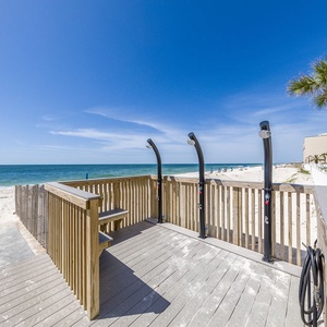 Step onto the beach walkway with convenient outdoor showers and soak in the stunning beachfront views