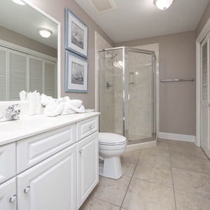 Refresh in this additional guest bath with a walk-in shower and laundry area with a washer and dryer in your rental