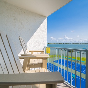 Relax in the comfortable chairs on your balcony and enjoy beautiful lagoon views while soaking in the coastal vibe