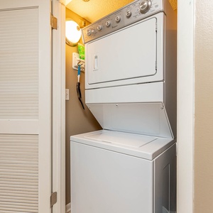 Conveniently handle laundry with the stacked washer and dryer, perfect for freshening up during your stay