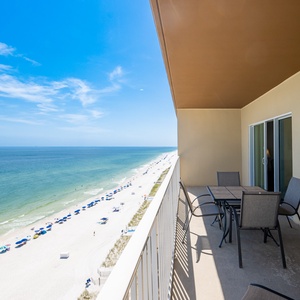 Enjoy stunning views from the balcony, complete with comfortable seating and a stunning shoreline below