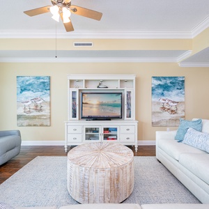 Nestle into the plush sofa, enjoying your favorite movie while surrounded by beach decor that enhances your vibe