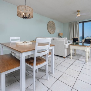 Dine at the table or relax in the living room seating area while enjoying the calming views through expansive windows