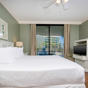 Unwind after a fun vacation day and stream your favorite shows in the king master suite with balcony access