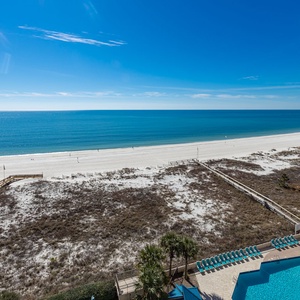 Take a moment to relax on your balcony, overlooking the pristine waters and a beautiful stretch of beach