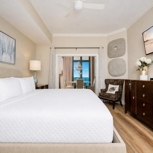 Wake refreshed in the master suite, and enjoy morning views from your balcony view beyond the dining area