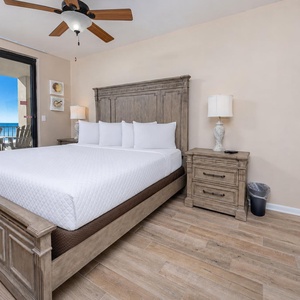 King bed in the master suite invites you to rest while the balcony offers calming gulf views and fresh air